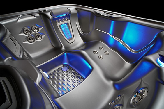 interior platinum colored shell of the jetsetter nxt hot tub with dramatic blue lighting
