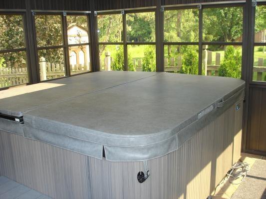 A hot tub in a sunroom combines the best of both the indoor and the outdoor worlds.