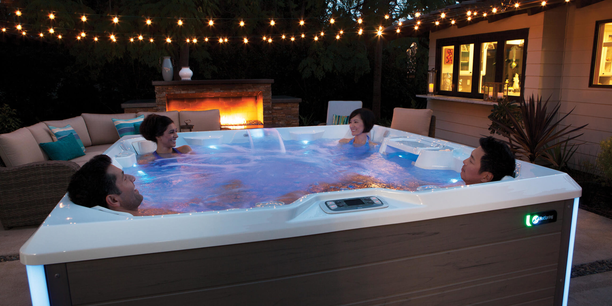 https://www.hotspring.com/wp-content/uploads/2022/03/hot-spring-spas-limelight-collection-page-cspot-lifestyle-night-group-in-spa-1-scaled.jpg