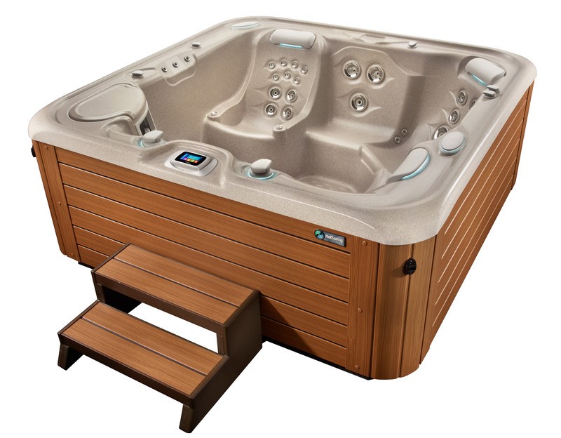 A luxurious hot spring spa with a high-quality acrylic shell, designed for durability and a smooth, clean look. The spa features modern accents and calming blue LED lighting.